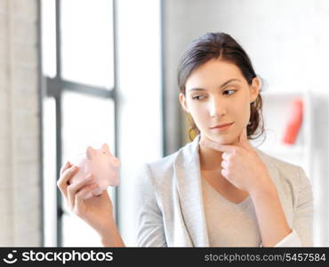 picture of lovely woman with piggy bank