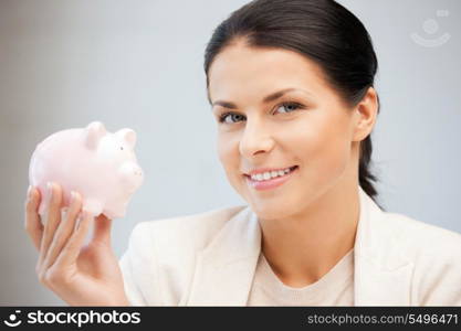 picture of lovely woman with piggy bank