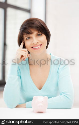 picture of lovely woman with piggy bank