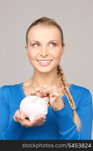 picture of lovely woman with piggy bank and money