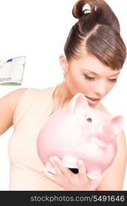 picture of lovely woman with piggy bank and money