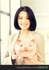 picture of lovely woman with piggy bank. lovely woman with piggy bank