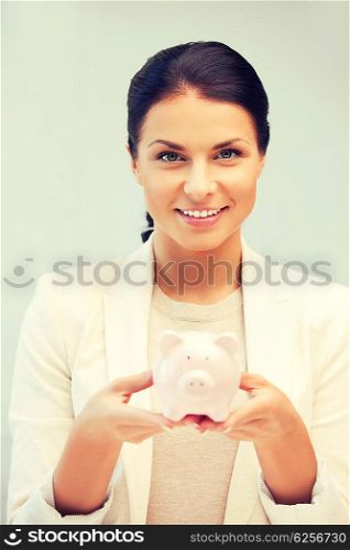 picture of lovely woman with piggy bank. lovely woman with piggy bank