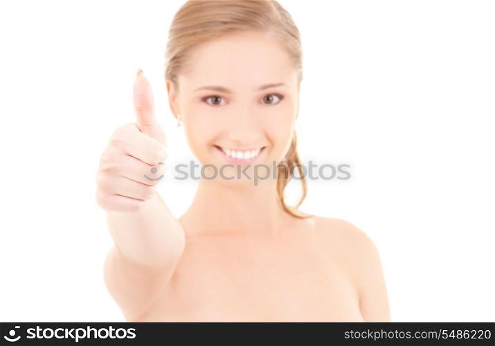 picture of lovely woman with thumbs up (focus on hand)
