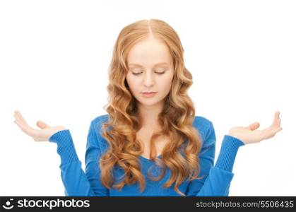 picture of ?lueless woman shrugging helpless with her shoulders &#xA;
