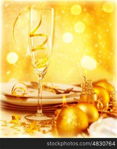 Picture of luxury festive table setting, closeup image of beautiful white utensil decorated with golden shiny balls and candle on blur glowing background, New Year eve, Christmas holiday dinner party
