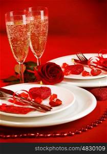 Picture of luxury table setting, romantic dinner, white festive utensil served with silverware and glasses for champagne, decorated with red rose flower and candles, Valentine day, love concept