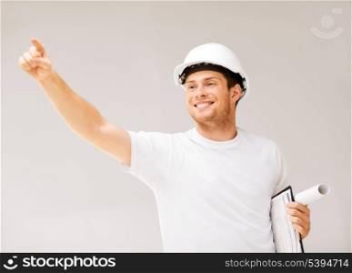 picture of male architect in helmet showing direction