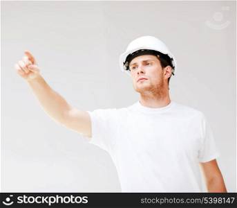 picture of male architect in helmet showing direction