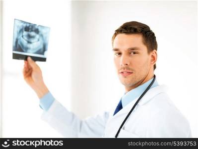 picture of male doctor or dentist with x-ray