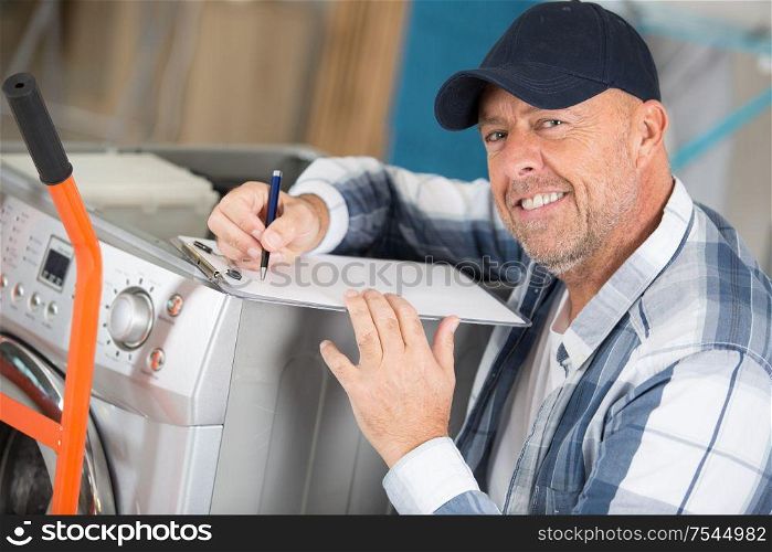 picture of male technician doing machine repair