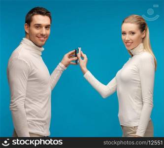 picture of man and woman with modern gadgets