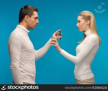 picture of man and woman with modern gadgets