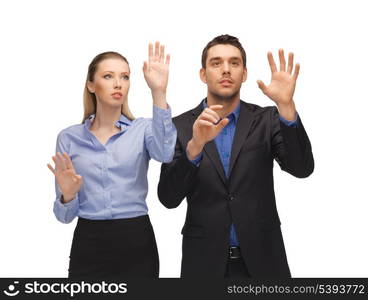 picture of man and woman working with something imaginary.