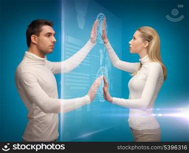 picture of man and woman working with virtual screens