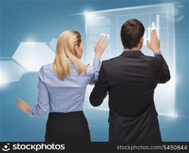 picture of man and woman working with virtual screens
