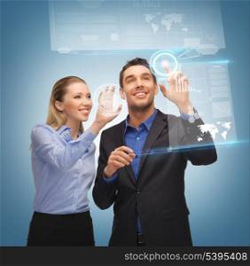 picture of man and woman working with virtual touch screens