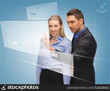 picture of man and woman working with virtual touch screens