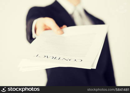 picture of man hands holding contract with random text