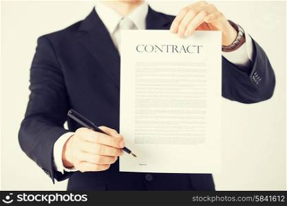 picture of man hands holding contract with random text