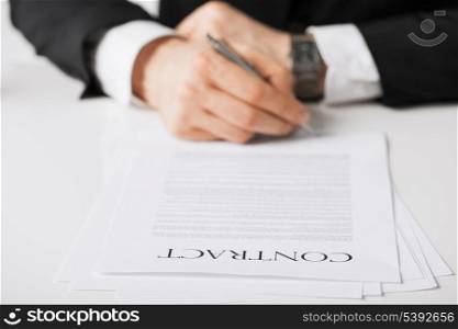 picture of man hands signing contract