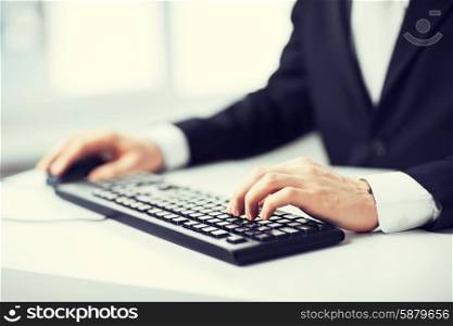 picture of man hands typing on keyboard