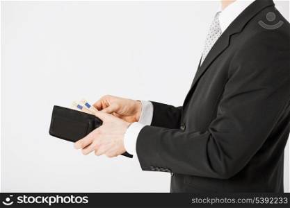 picture of man hands with purse counting euro cash money