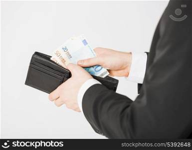 picture of man hands with purse counting euro cash money