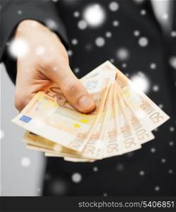 picture of man in suit with euro cash money