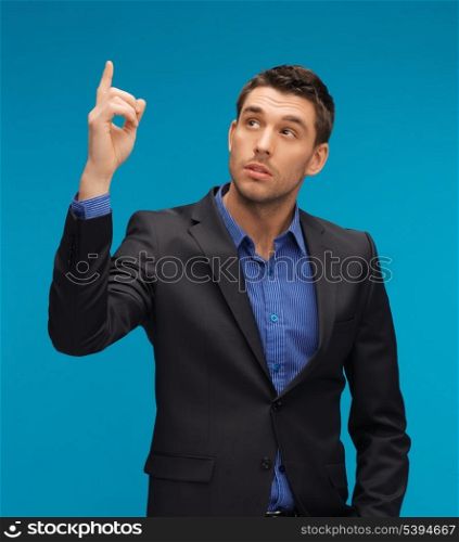 picture of man in suit with his finger up.