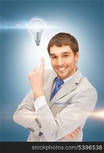 picture of man in suit with light bulb