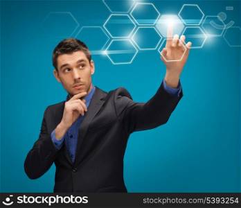 picture of man in suit working with virtual screens
