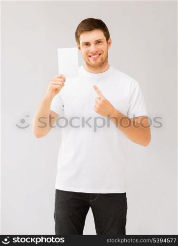 picture of man pointing at blank white paper