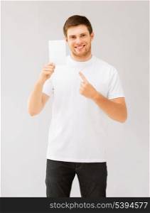picture of man pointing at blank white paper