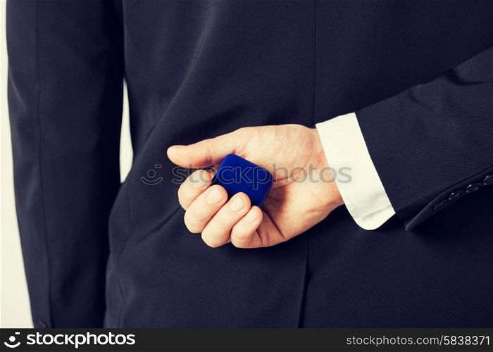picture of man with gift box in suit