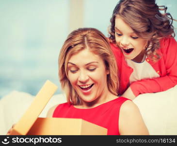 picture of mother and daughter with box