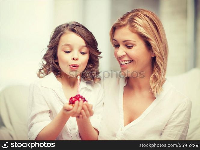 picture of mother and daughter with cupcake