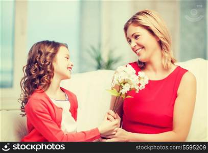 picture of mother and daughter with flowers