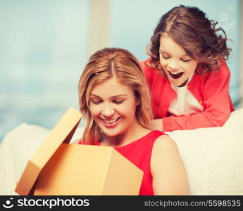 picture of mother and daughter with gift box