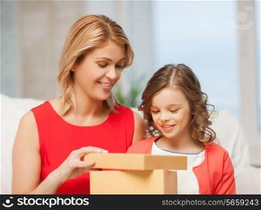 picture of mother and daughter with gift box