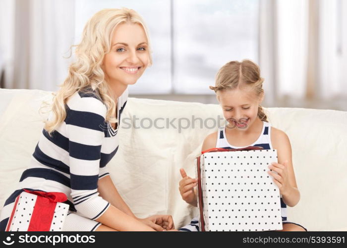 picture of mother and little girl with gifts.