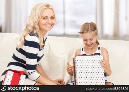 picture of mother and little girl with gifts.