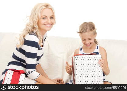 picture of mother and little girl with gifts.