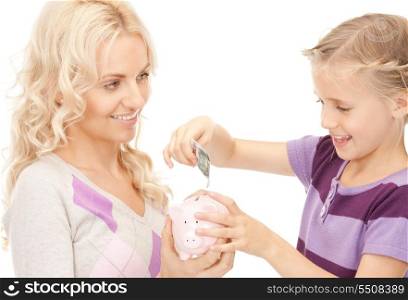 picture of mother and little girl with piggy bank