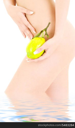 picture of naked woman with lemon over white