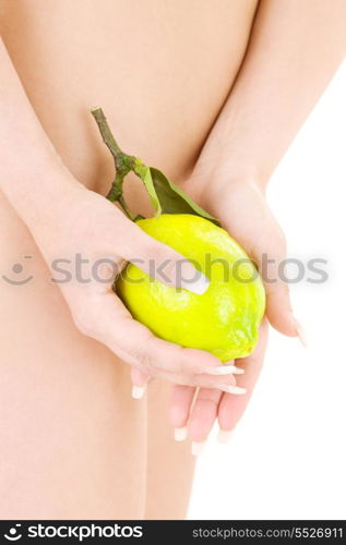 picture of naked woman with lemon over white