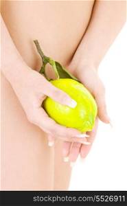 picture of naked woman with lemon over white