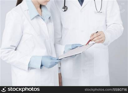picture of nurse and male doctor holding cardiogram
