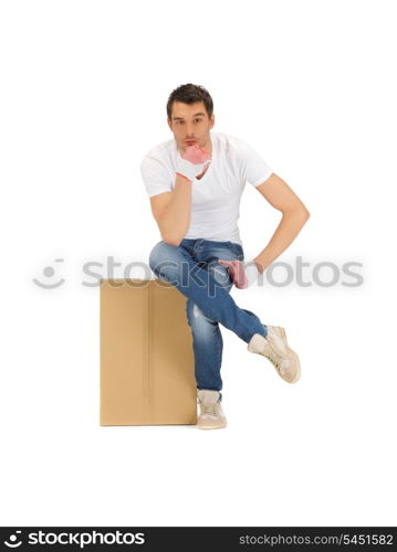 picture of pensive handsome man with big box.