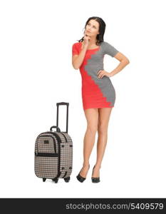 picture of pensive woman in dress with suitcase